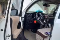 May be an image of van and car